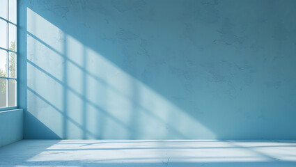 Sunlight illuminating empty blue room with window and concrete floor