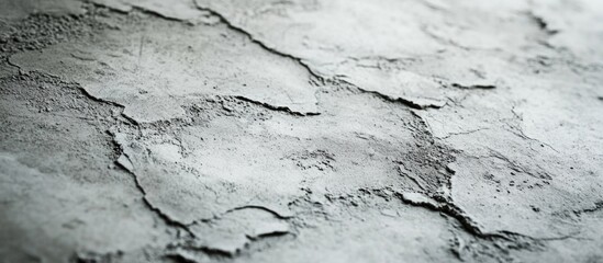 Obraz premium Cracked concrete texture background in grey tones with rough surfaces and copy space for design layouts