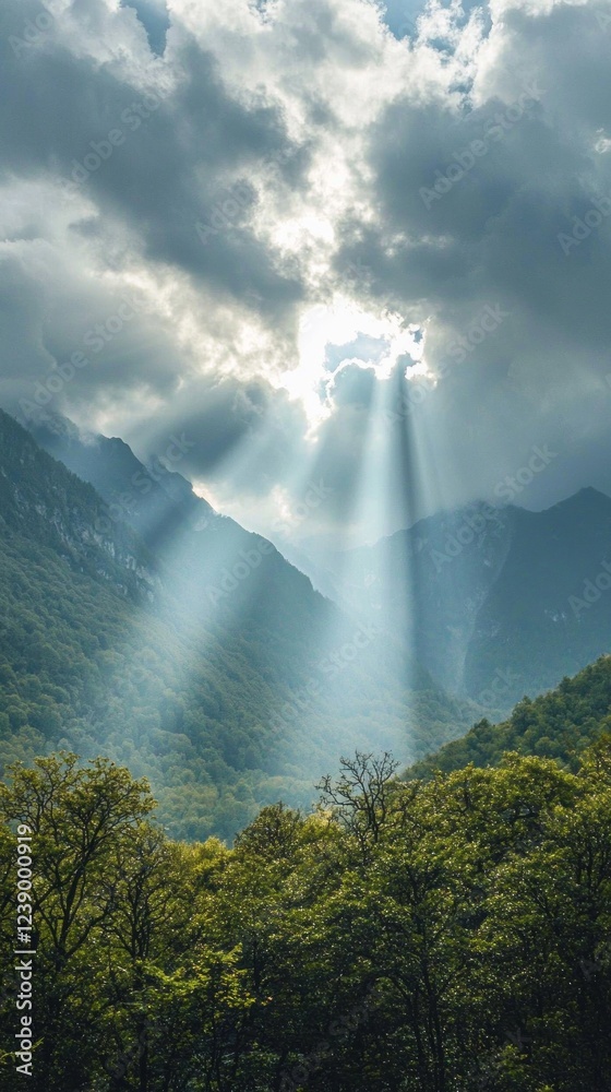 Aufkleber sunlight pours through gaps in the clouds, casting ethereal beams over lush green valleys and rugged