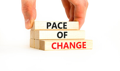 Pace of change symbol. Concept words Pace of change on beautiful wooden blocks. Beautiful white table white background. Businessman hand. Business pace of change concept. Copy space.