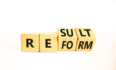 Reform and result symbol. Concept words Reform Result on beautiful wooden block. Beautiful white...
