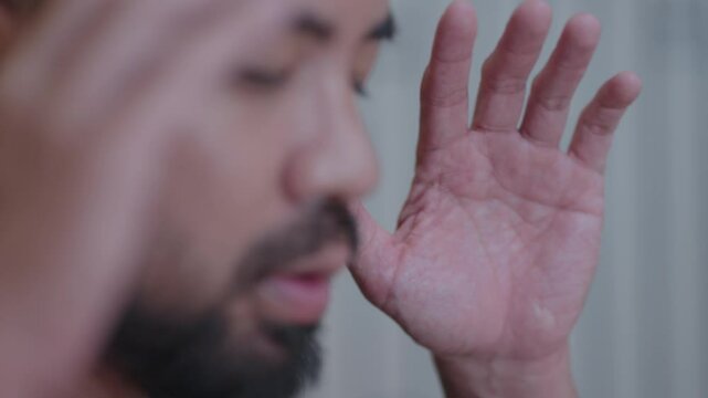 Southeast Asian Muslim Man with Black Shirt Salah Salat Zikr Holy Quran Reading Islam Prayer Islamic Ritual in Bed Room