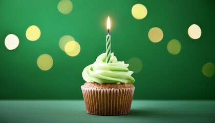 unmarried birthday cupcake with candle on inexperienced