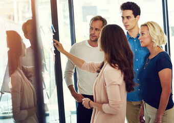 People, woman and pointing at glass for planning, strategy or creative collaboration in workshop....