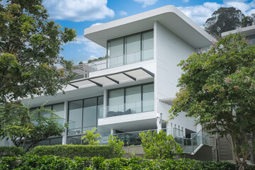 New homes facade exterior. Custom build home design. Modern contemporary style villas on a sunny day