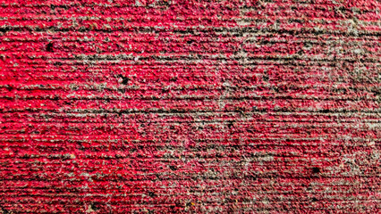Obraz premium abstract red color rough stamped texture blank empty concrete surface presentation template backdrop