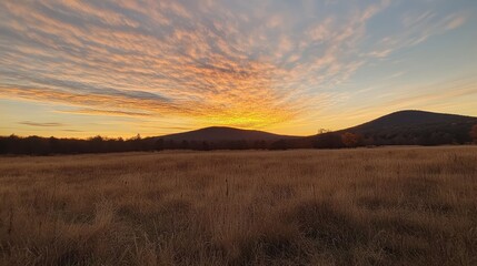 Fototapeta premium Golden Sunset Over Serene Mountain Landscape