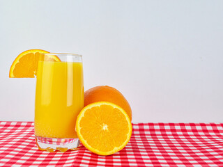 glass of orange juice on a white background