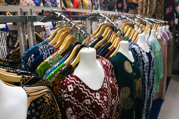 Women's Clothing with Colorful Patterns on Hangers at Beringharjo Market, Yogyakarta