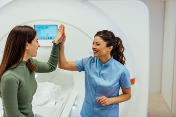 Medical Professional Celebrating Successful Scan with Smiling Patient
