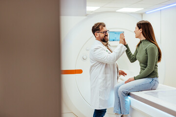 Doctor and Patient Sharing a High-Five in a Medical Setting