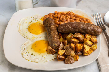 two ried eggs top with parsley  with  sweet italian sauage