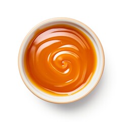 Caramel Sauce Delight - Top View of Isolated Bowl on White Background. Toffee, Liquid, Candy and Brown Spot Keywords Included