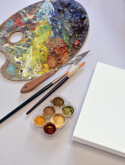pain palette brushes colors paint, canvas board & artistic tools composition.