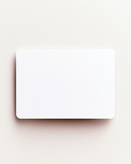 Fototapeta premium Minimalistic blank white rectangular card mockup on light grey surface