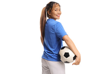 Asian female football player holding a ball