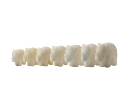 Seven old vintage marble elephants of different sizes on a transparent background. Vintage interior items. PNG.