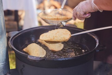 The process of making chebureks or haluts. A traditional dish of the peoples of the Caucasus.