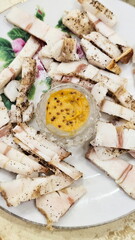 Lard with mustard on a light background