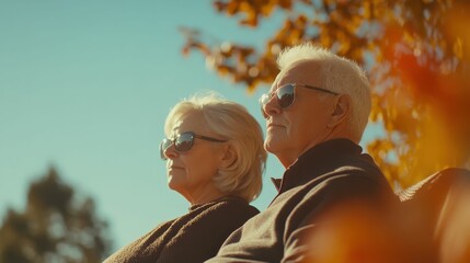 Fototapeta premium Elderly parents resting together in a sunny garden, surrounded by flowers, soft natural lighting, serene and loving outdoor scene