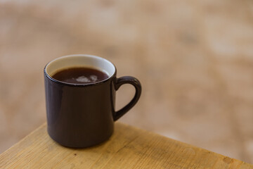 A mug of hot black coffee