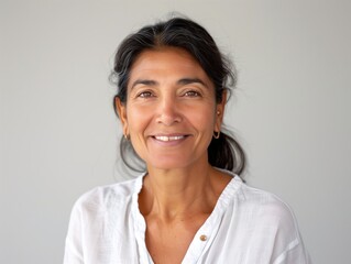 Beautiful Indian woman smiling proudly on a clean white background. Perfect for social media, advertising, and marketing.