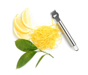 Lemon zest, fruit slices and zester tool isolated on white, top view