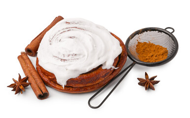 Tasty cinnamon roll with cream and spices isolated on white