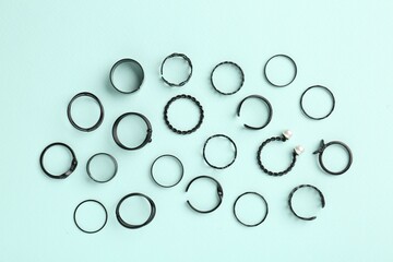 Stylish accessories on light blue background, flat lay