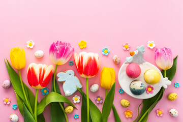 Easter eggs with decorative bunnies and tulips with gypsophila
