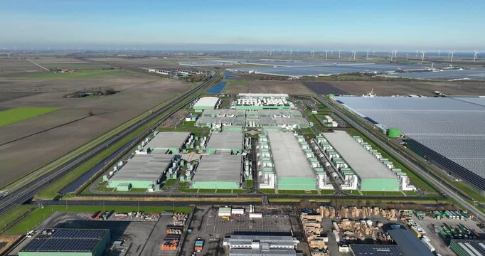 Aerial drone views of a supercomputer data center, artificial intelligence, and internet infrastructure in the Netherlands. Big data, quantum computing, supercomputer.