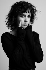 an emotional portrait of a beautiful curly-haired girl