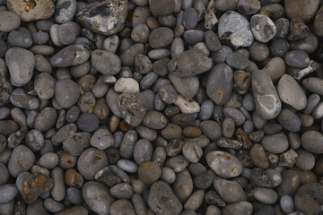 Collection of coastal sea pebbles for wallpaper, filmed on the shores of the English Channel in the French town of Etretat