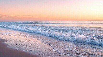 Obraz premium Serene Sunrise Over Calm Ocean Waves on Sandy Beach Shoreline