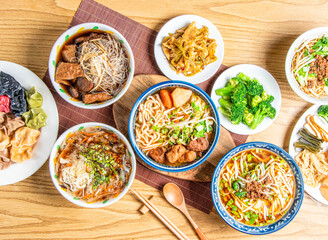 Colorful Steamed Dumplings, Angelica Vermicelli, Rice Noodles Soup, Vegetarian Noodle, beef Noodles, dan dan noodle with mince meat, broccoli, Fried sauerkraut, braised cabbage, lu rou fan top view
