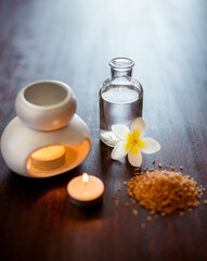 Incense, spa and aromatherapy candle on table with flower, peace and natural fragrance. Holistic health, hospitality service and powder with essential oil for self care at luxury wellness salon
