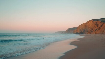 Serene Beach Sunset with Gentle Waves and Soft Pink Sky
