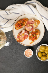 Tasty bruschetta served with wine on gray background. High quality photo