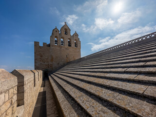 The bell tower of the Church of the Saintes Maries de la Mer , a Romanesque fortified church built in the 9th century in Saintes-Maries-de-la-Mer in Camargue