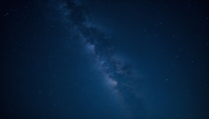 Fototapeta premium A close-up of the Milky Way stretching across a dark blue night sky, with faint constellations visible, minimal and mesmerizing setup