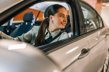 Businesswoman parking in reverse in an underground garage.