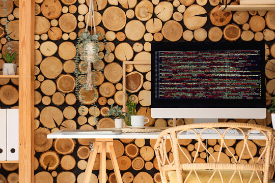 Stylish workplace of programmer with modern computer in light office