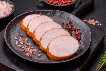Delicious fresh ham cut into round slices with salt, spices and herbs