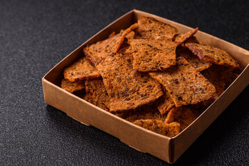 Crispy homemade brown bread chips with seeds and grains