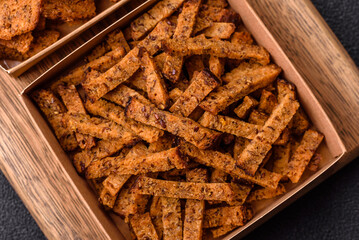 Crispy homemade brown bread crackers or croutons with seeds and grains