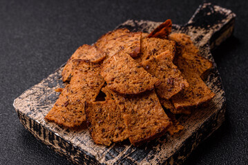 Crispy homemade brown bread chips with seeds and grains