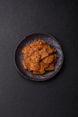 Crispy homemade brown bread chips with seeds and grains