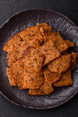 Crispy homemade brown bread chips with seeds and grains