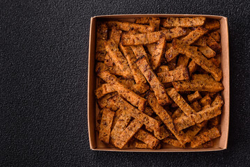 Crispy homemade brown bread crackers or croutons with seeds and grains