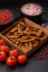 Crispy homemade brown bread crackers or croutons with seeds and grains